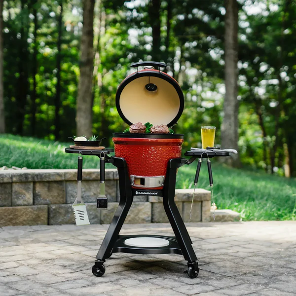 Red ceramic grill in a sunlit garden representing the Middleby Outdoor case study